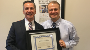 Tim Eyman presents Dino Rossi with a certificate