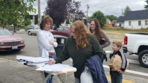 A woman signing Referendum 88