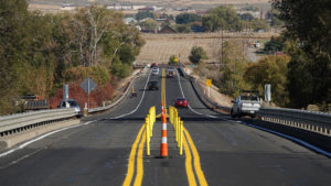 Traffic lanes are adjusted across a bridge on State Route 823, to reduce stress on a damaged bridge girder