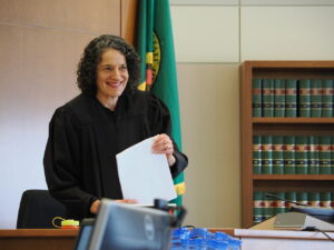 Judge Sandra Widlan prepares to read her verdict